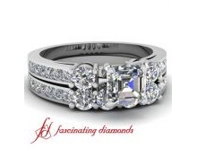 This Unique Engagement Ring features 2 round diamonds next to the center diamond of your choice.The ring also has Channel round diamonds accenting the sides of the shank. Also available in 18k and 950 platinum.